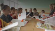 Kids unwrapping gifts of BPB bank Kosovo